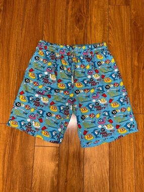 Blue beach themed shorts with 8 ball design